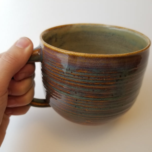 Close up of speckle blue mug, little j studio, handmade portland pottery