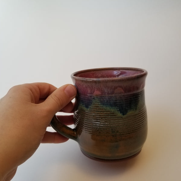 Holding sunset mug, little j studio, handmade portland pottery